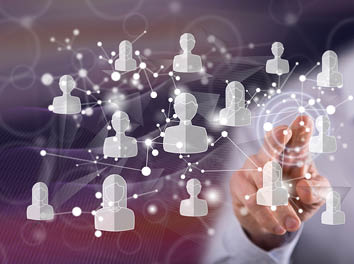 Man touching a social media network concept on a touch screen with his finger